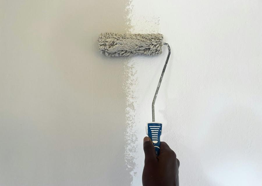 Wall being painted with a roller